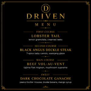 A black and gold menu titled Driven Menu lists lobster tail, black Angus deckle steak, beef vol-au-vent, and dark chocolate ganache with accompanying ingredients.